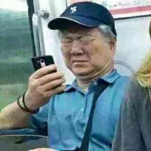Subway_Senior_Watching_Phone